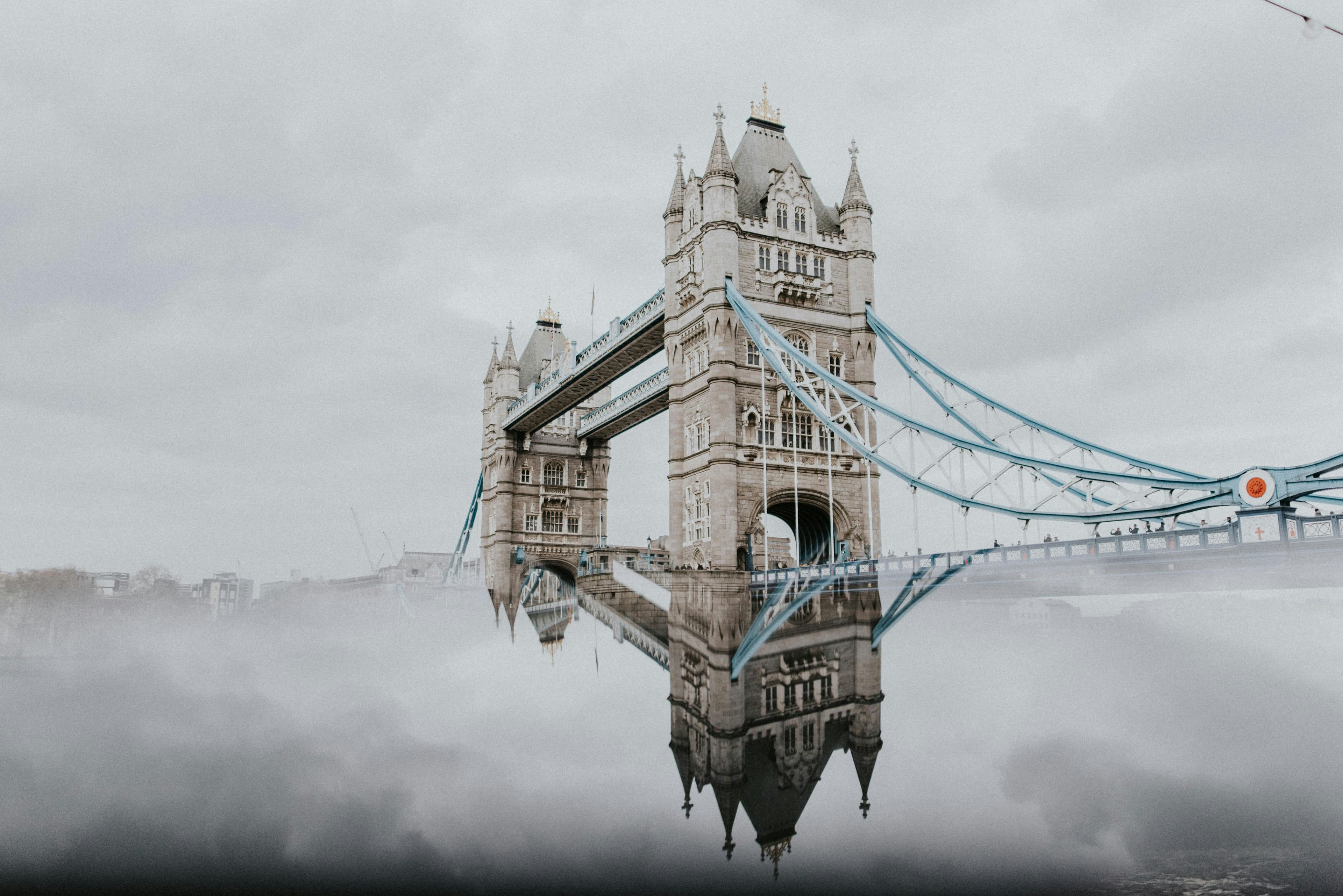 Tower Bridge rising through morning mist over the Thames — map-first planning intelligence, end to end.